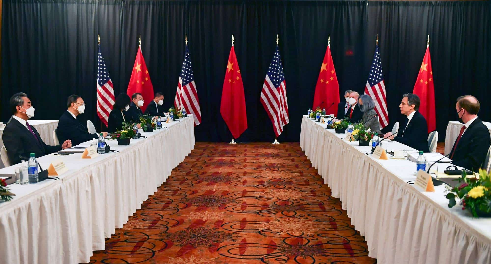 US Secretary of State Antony Blinken (2nd R), joined by National Security Advisor Jake Sullivan (R), speaks while facing Yang Jiechi (2nd L), director of the Central Foreign Affairs Commission Office, and Wang Yi (L), China's Foreign Minister at the opening session of US-China talks at the Captain Cook Hotel in Anchorage, Alaska on March 18, 2021. - China's actions "threaten the rules-based order that maintains global stability," US Secretary of State Antony Blinken said Thursday at the opening of a two-day meeting with Chinese counterparts in Alaska. (Photo by Frederic J. BROWN / POOL / AFP)