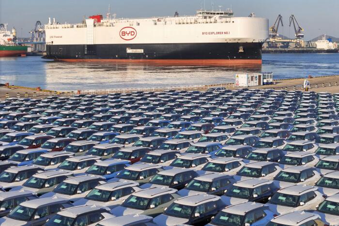 The photo taken on January 10, 2024 shows electric cars for export waiting to be loaded on the "BYD Explorer NO.1", a domestically manufactured vessel intended to export Chinese automobiles, at Yantai port, in eastern China's Shandong province. China OUT
 (Photo by AFP)